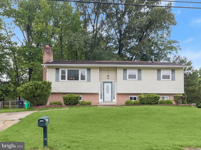 7107 Dower House Rd, Upper Marlboro, MD 20772 - split foyer home featuring a front yard and a chimney