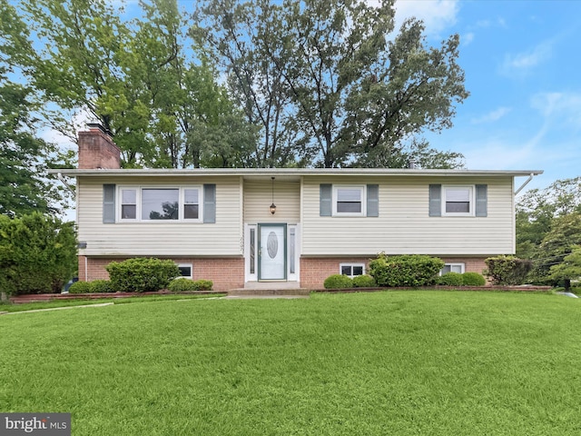 7107 Dower House Rd, Upper Marlboro, MD 20772 - raised ranch with a front lawn and a chimney