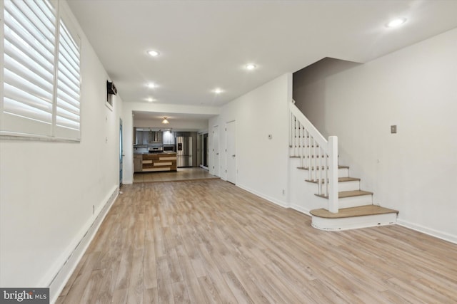 unfurnished living room featuring light wood-type flooring