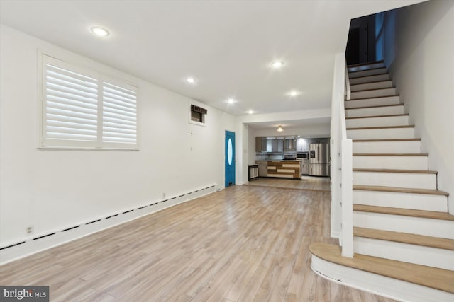 interior space featuring a baseboard radiator and light wood-type flooring