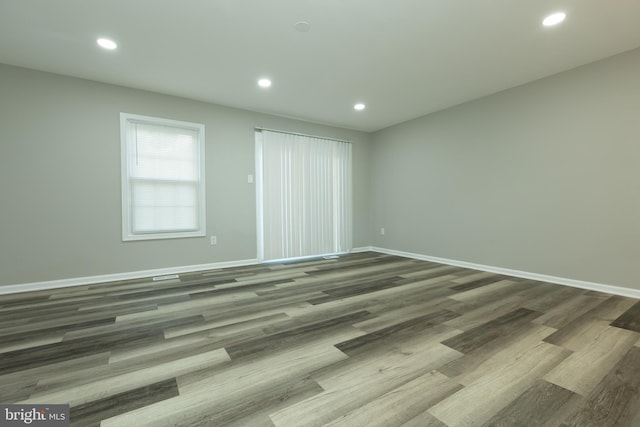 unfurnished bedroom with hardwood / wood-style flooring