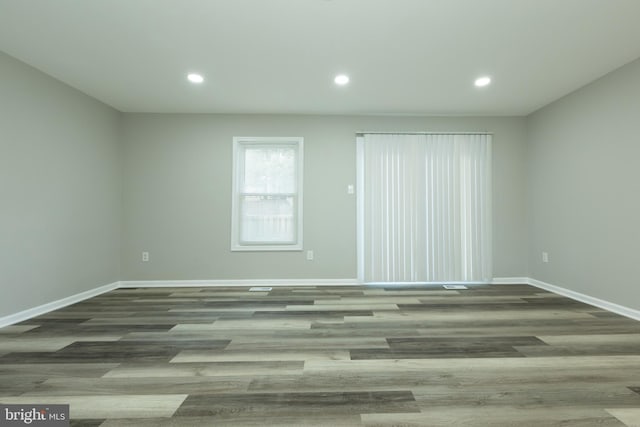 empty room with wood-type flooring