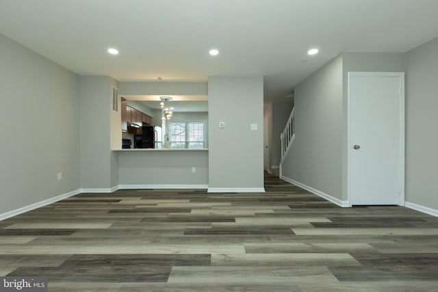 unfurnished living room featuring wood-type flooring