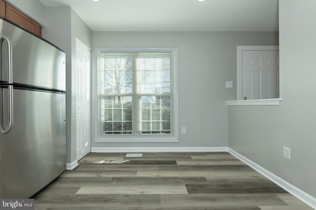 unfurnished dining area with light hardwood / wood-style flooring