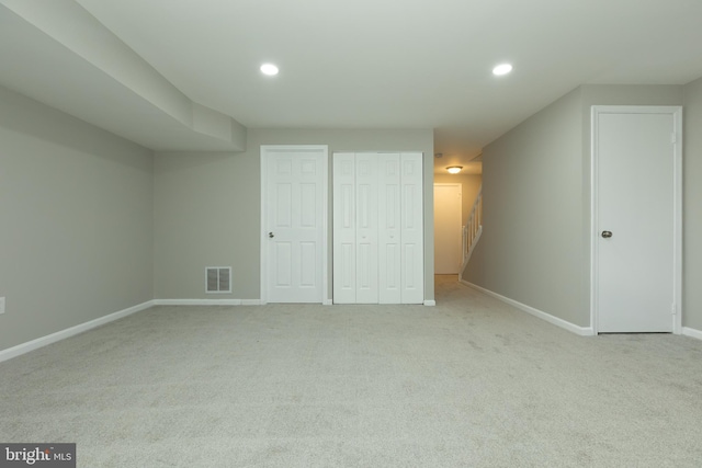 bonus room with light carpet