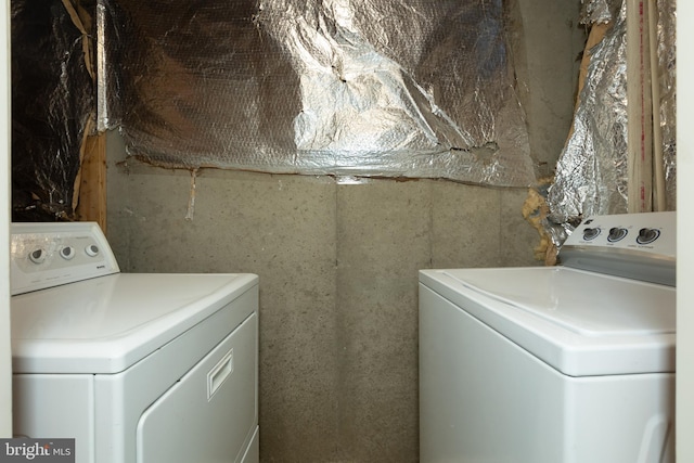 laundry room featuring separate washer and dryer