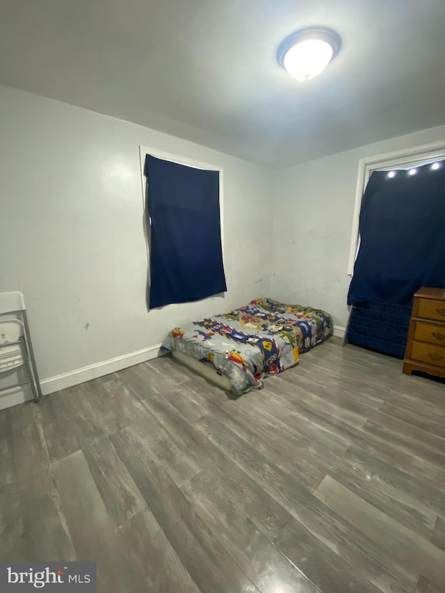 unfurnished bedroom with hardwood / wood-style floors