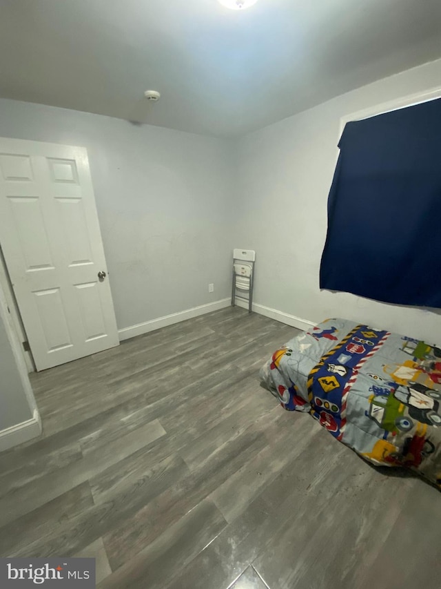 unfurnished bedroom with wood-type flooring