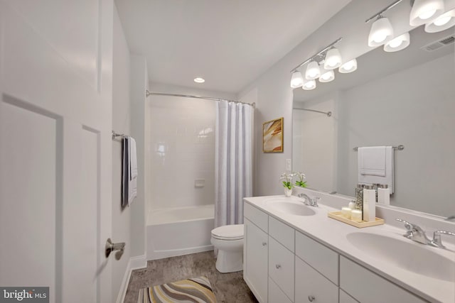 full bathroom with wood-type flooring, vanity, toilet, and shower / bathtub combination with curtain