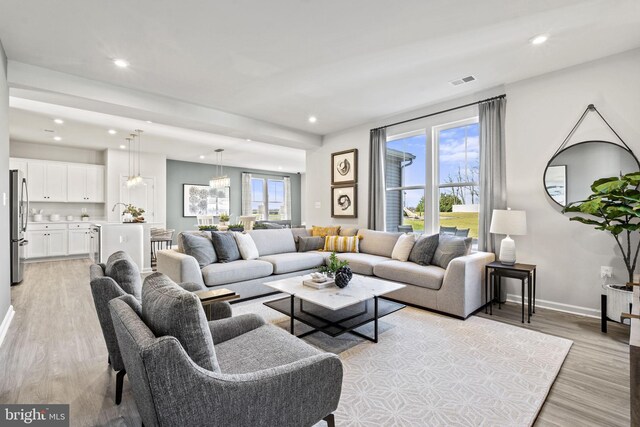 living room with light hardwood / wood-style flooring