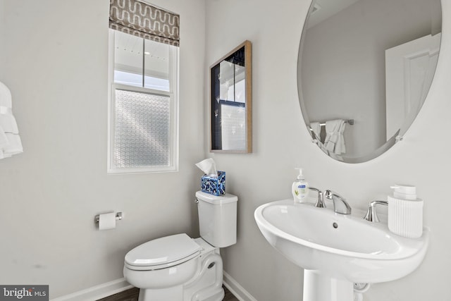 bathroom featuring sink and toilet