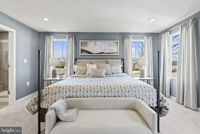 bedroom featuring carpet floors and connected bathroom