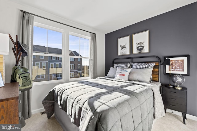 bedroom with light carpet