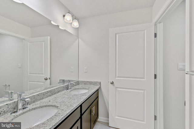 bathroom featuring tile patterned floors and vanity