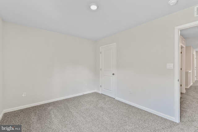 unfurnished room with carpet flooring