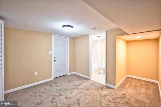 entrance foyer featuring light colored carpet