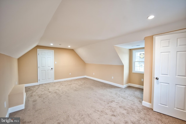 additional living space with carpet and lofted ceiling