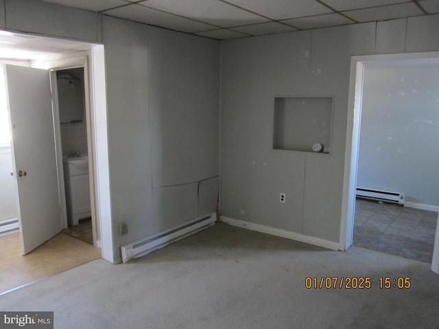 empty room featuring light carpet and a baseboard radiator