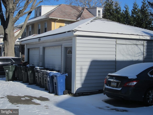 view of snow covered garage