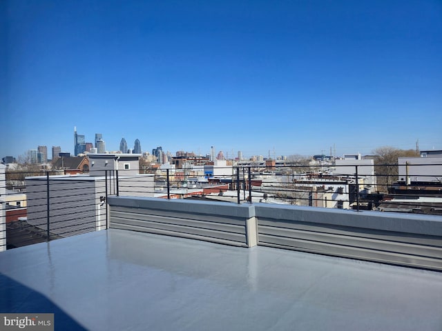 exterior space with a balcony and a view of city