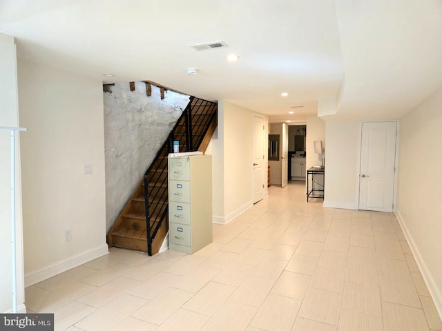 below grade area with stairway, recessed lighting, baseboards, and visible vents