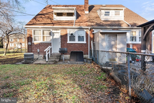 rear view of property featuring central air condition unit