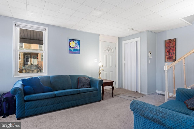 living room featuring light carpet