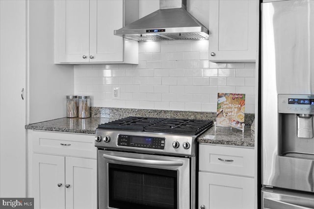 kitchen featuring white cabinetry, wall chimney exhaust hood, and appliances with stainless steel finishes