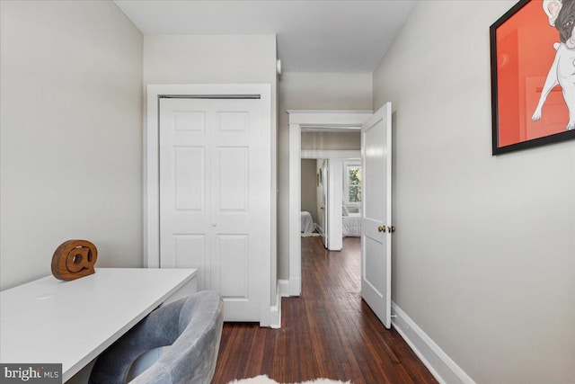 corridor featuring dark hardwood / wood-style flooring