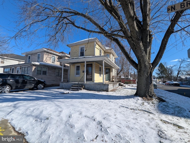 view of property featuring a porch