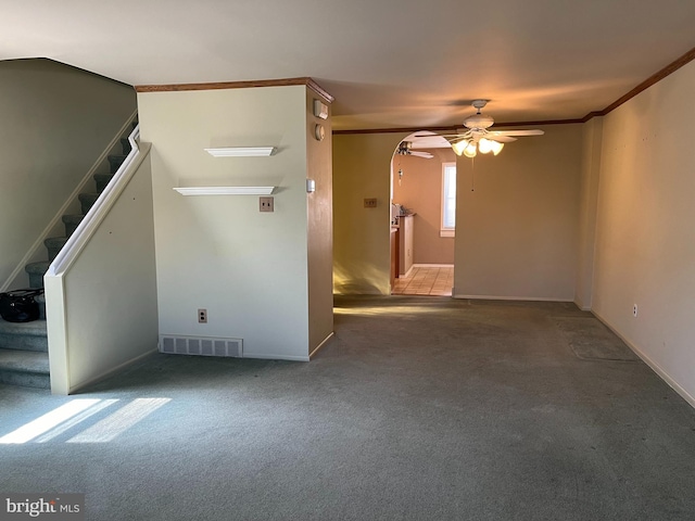 spare room with visible vents, carpet, ornamental molding, and stairs