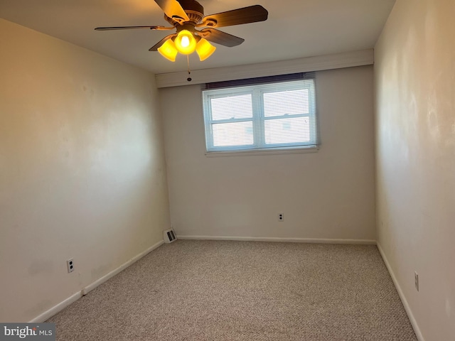 unfurnished room with baseboards, carpet, and a ceiling fan