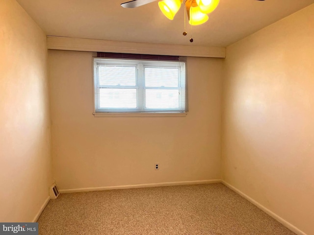 unfurnished room featuring baseboards, carpet, and a ceiling fan