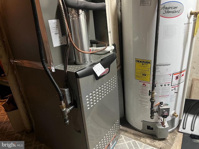 utility room with heating unit and gas water heater