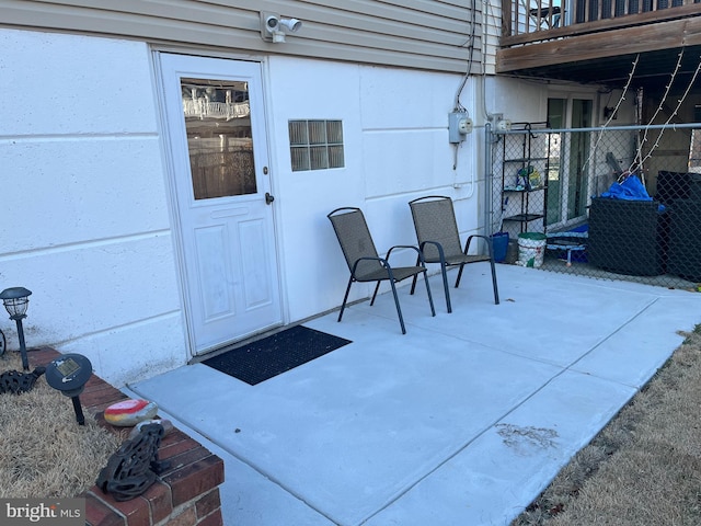 entrance to property featuring a patio