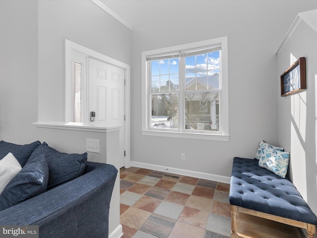 sitting room with ornamental molding