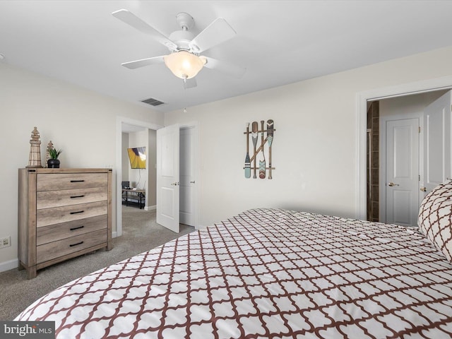 bedroom featuring ceiling fan and dark carpet