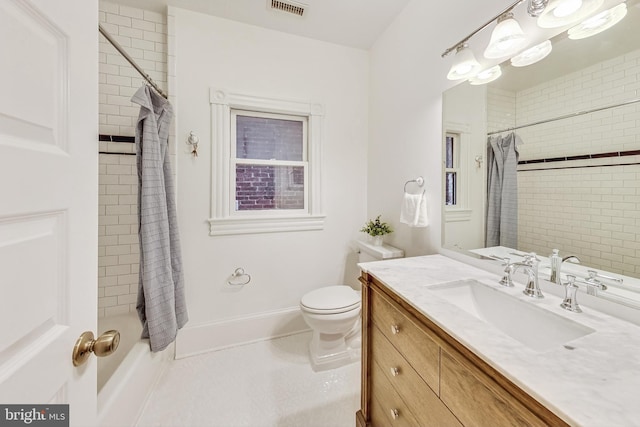 bathroom with toilet, tile patterned flooring, and vanity