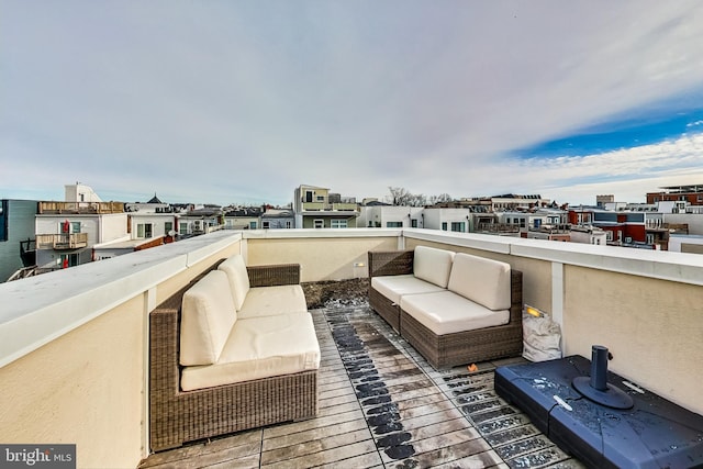 view of patio / terrace with a balcony and an outdoor living space