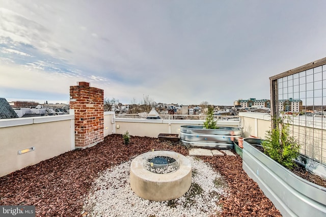 view of patio featuring an outdoor fire pit