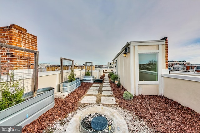 view of yard with a fire pit