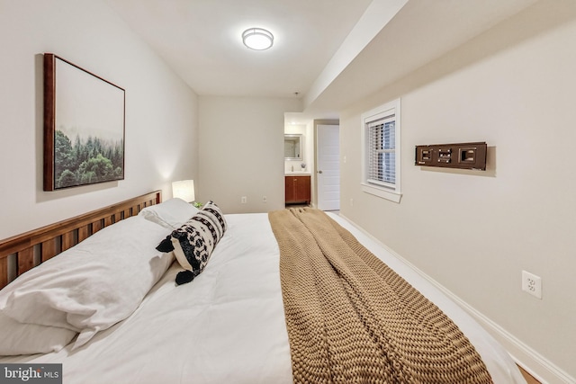 bedroom featuring ensuite bath