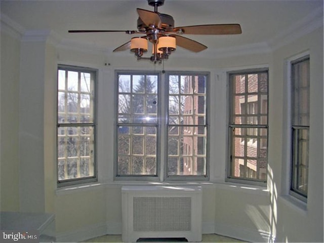 interior space featuring ceiling fan