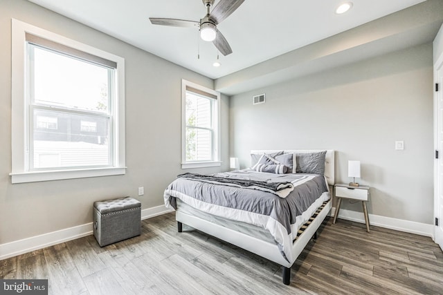 bedroom featuring hardwood / wood-style floors and ceiling fan