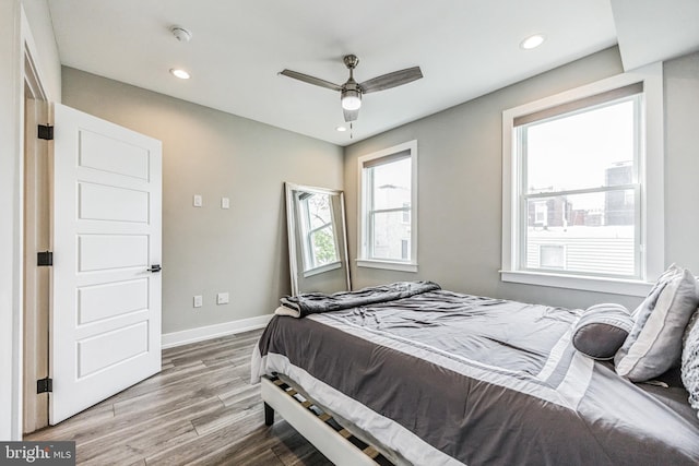 bedroom featuring hardwood / wood-style floors and ceiling fan