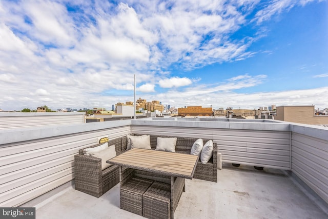 view of patio featuring a balcony