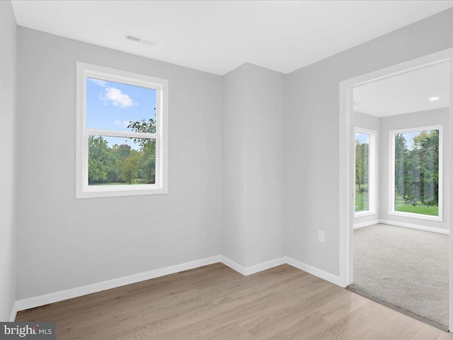 unfurnished room with light hardwood / wood-style flooring