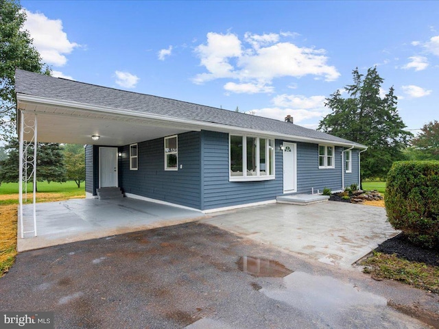 ranch-style home with a carport