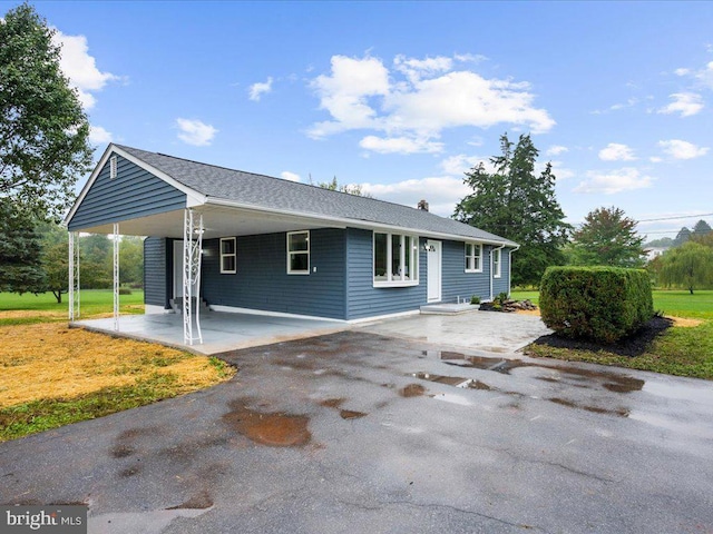 view of front of house featuring a carport