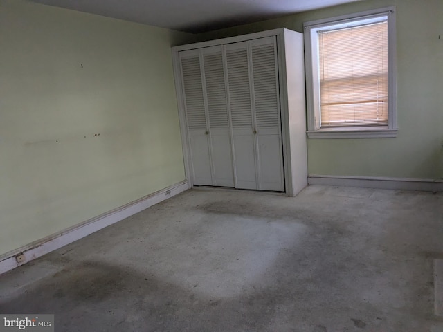 unfurnished bedroom with a closet